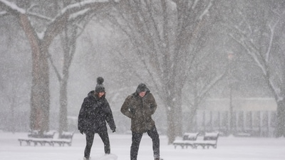 People make their way during a winter snow storm in Washington, Monday, Jan. 6, 2025. (AP Photo/Matt Rourke) (AP)