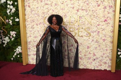 Viola Davis' shows off her cape in a wing-like effect Viola Davis' shows off her cape in a wing-like effect
