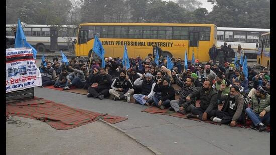 Contractual transport workers during a strike at the Ludhiana bus terminal on Monday. (Manish/HT)
