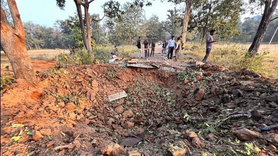 Visuals from the spot showed a huge crater, more than 14-feet deep, splitting the narrow road near a culvert at the site. (HT Photo)