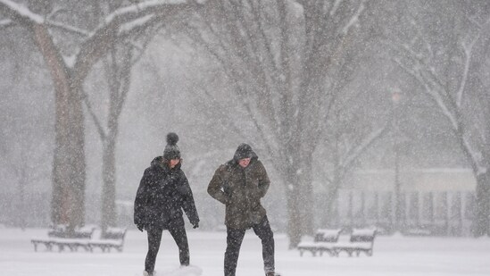 People make their way during a winter snow storm in Washington, Monday, Jan. 6, 2025. (AP Photo/Matt Rourke) (AP)
