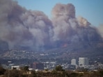 Smoke rises from a wildfire burning near Pacific Palisades on the west side of Los Angeles during a weather driven windstorm, in Los Angeles, California, January 7, 2025. 