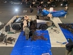 Investigators inspect the burned Tesla Cybertruck, which the police say was driven by Matthew Livelsberger, 37, an active-duty Army soldier from Colorado Springs, after it exploded in front of the Trump International Hotel in Las Vegas.