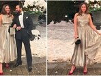 Kareena Kapoor's glamorous New Year look features a stunning metallic midi dress. Kareena Kapoor's glamorous New Year look features a stunning metallic midi dress.