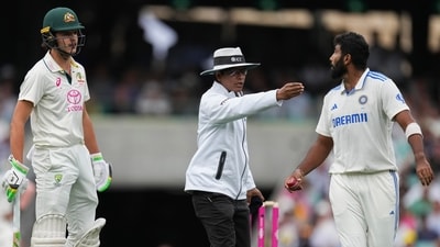 Umpire Sharfuddoula Saikat, centre, gestures to India's Jasprit Bumrah, right, as he exchanges words with Australia's Sam Konstas (AP) Umpire Sharfuddoula Saikat, centre, gestures to India's Jasprit Bumrah, right, as he exchanges words with Australia's Sam Konstas (AP)