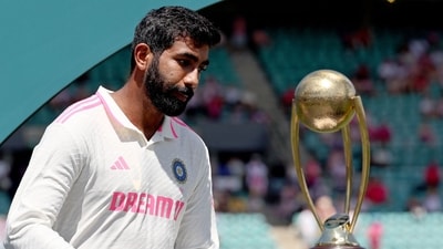 India's Jasprit Bumrah reacts as he walks past the trophy during an official ceremony after the fifth cricket Test match between Australia and India (AFP) India's Jasprit Bumrah reacts as he walks past the trophy during an official ceremony after the fifth cricket Test match between Australia and India (AFP)
