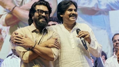 Ram Charan and Pawan Kalyan at the pre-release event of Game Changer. Ram Charan and Pawan Kalyan at the pre-release event of Game Changer.