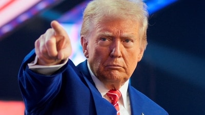 U.S. President-elect Donald Trump gestures at Turning Point USA's AmericaFest in Phoenix, Arizona, U.S., December 22, 2024. (REUTERS)