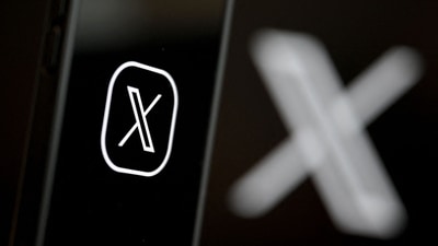 This illustration photograph shows the logo of social network X (formerly Twitter) displayed on a smartphone. (AFP/File)