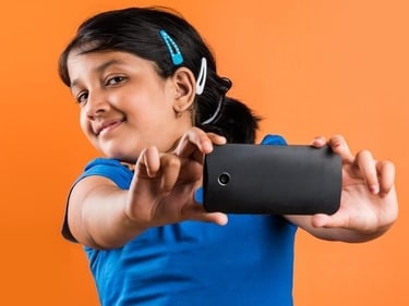 Experts say that children must avoid looking at smartphone screens for more than 30 minutes at a time, and parents should take their children to see a doctor if their eyes seem to be deviated. (For representation purpose only) (Shutterstock) Experts say that children must avoid looking at smartphone screens for more than 30 minutes at a time, and parents should take their children to see a doctor if their eyes seem to be deviated. (For representation purpose only) (Shutterstock)