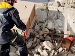 A member of the rescue team works amidst rubble in the aftermath of an earthquake in Tibet