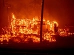 A structure burns during the Palisades Fire in the Pacific Palisades neighborhood of Los Angeles, California, US, on Tuesday, Jan. 7, 2025. Uncontrolled wildfires tore through parts of the Los Angeles region, fanned by extreme winds, forcing thousands of residents to flee and grounding firefighting aircraft. Photographer: Kyle Grillot/Bloomberg A structure burns during the Palisades Fire in the Pacific Palisades neighborhood of Los Angeles, California, US, on Tuesday, Jan. 7, 2025. Uncontrolled wildfires tore through parts of the Los Angeles region, fanned by extreme winds, forcing thousands of residents to flee and grounding firefighting aircraft. Photographer: Kyle Grillot/Bloomberg