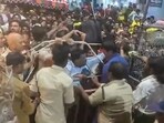 Tirupati: Police personnel try to control the crowd as hundreds of devotees jostle for tickets for Vaikunta Dwara Darshanam.