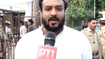 **EDS: SCREENGRAB VIA PTI VIDEOS** Mumbai: NCP (Ajit Pawar) candidate Zeeshan Siddique interacts with the media as he arrives at a polling station to cast vote during the Maharashtra Assembly elections, in Mumbai, Wednesday, Nov. 20, 2024. (PTI Photo) (PTI11_20_2024_000081B) (PTI)