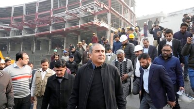 Pakistan's Interior Minister and PCB chief Mohsin Naqvi, center, and Pakistan Cricket Board officials arrive to visit the Gaddafi Stadium upgradation work in preparation for the upcoming ICC Champions Trophy 2025, in Lahore, Pakistan. (AP) Pakistan's Interior Minister and PCB chief Mohsin Naqvi, center, and Pakistan Cricket Board officials arrive to visit the Gaddafi Stadium upgradation work in preparation for the upcoming ICC Champions Trophy 2025, in Lahore, Pakistan. (AP)