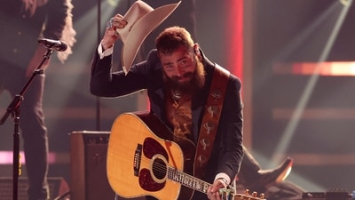 Post Malone performs at the 58th Annual CMA Awards, in Nashville, Tennessee, U.S., November 20, 2024. REUTERS/Seth Herald (REUTERS)