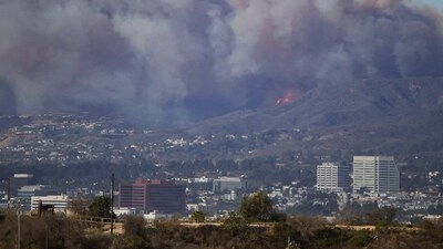 Forecasters cautioned that the worst could still be to come, as the windstorm is expected to persist for days and cause isolated gusts of up to 100 mph (160 kph) in the foothills and mountains, especially in places that haven't had significant rainfall in months. (REUTERS/Daniel Cole )