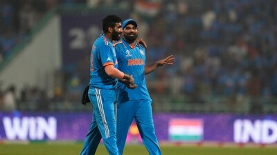 India's Jasprit Bumrah, left, celebrates with teammate Mohammed Shami as they leave the field after India win their ICC Men's Cricket World Cup match against England. (AP) India's Jasprit Bumrah, left, celebrates with teammate Mohammed Shami as they leave the field after India win their ICC Men's Cricket World Cup match against England. (AP)
