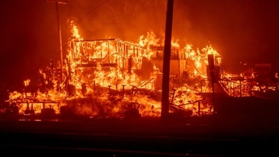 A structure burns during the Palisades Fire in the Pacific Palisades neighborhood of Los Angeles, California, US, on Tuesday, Jan. 7, 2025. Uncontrolled wildfires tore through parts of the Los Angeles region, fanned by extreme winds, forcing thousands of residents to flee and grounding firefighting aircraft. Photographer: Kyle Grillot/Bloomberg (Bloomberg)