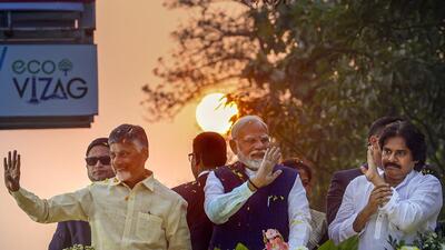 Prime Minister Narendra Modi with Andhra Pradesh chief minister N Chandrababu Naidu and deputy chief minister Pawan Kalyan during a roadshow, in Visakhapatnam. (PTI) Prime Minister Narendra Modi with Andhra Pradesh chief minister N Chandrababu Naidu and deputy chief minister Pawan Kalyan during a roadshow, in Visakhapatnam. (PTI)