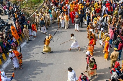 Sadhus partake in a stick fight in the 'Chavni Pravesh' procession on their way to the Maha Kumbh. (PTI) Sadhus partake in a stick fight in the 'Chavni Pravesh' procession on their way to the Maha Kumbh. (PTI)