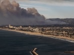 Smoke from the Palisades Fire is seen during a commercial flight to Los Angeles, Calif., Wednesday, Jan. 8, 2025. (Stephen Lam/San Francisco Chronicle via AP) Smoke from the Palisades Fire is seen during a commercial flight to Los Angeles, Calif., Wednesday, Jan. 8, 2025. (Stephen Lam/San Francisco Chronicle via AP)