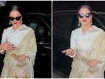 Rekha gets clicked by the paparazzi during a dinner outing. Rekha gets clicked by the paparazzi during a dinner outing.