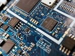 Semiconductor chips are seen on a circuit board of a computer in this illustration picture. REUTERS/Florence Lo/Illustration/File Photo