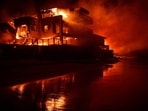 A beach house is engulfed in flames as the Palisades Fire burns along Pacific Coast Highway in Malibu, California.
