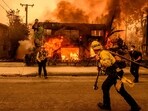 Firefighters work during the Eaton fire in the Altadena area of Los Angeles county 