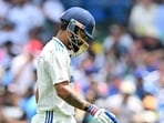 Virat Kohli walks back after his dismissal on Day 1 of Sydney Test on Friday. (AFP)