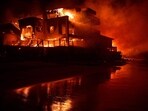 A beach house is engulfed in flames as the Palisades Fire burns along Pacific Coast Highway in Malibu, California, on January 8.