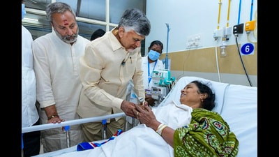 Andhra Pradesh chief minister N Chandrababu Naidu meets a person injured in the stampede on Thursday at SVIMS hospital in Tirupati. (PTI) Andhra Pradesh chief minister N Chandrababu Naidu meets a person injured in the stampede on Thursday at SVIMS hospital in Tirupati. (PTI)
