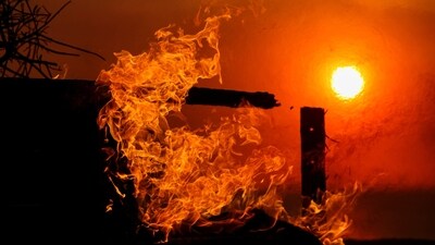 Flames rise from a beachfront home along the road to Malibu, as powerful winds fueling devastating wildfires in the Los Angeles area force people to evacuate, California. (REUTERS)