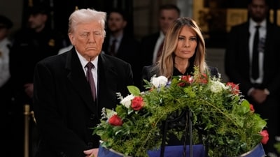 President-elect Donald Trump and Melania Trump pause at the flag-draped casket of former President Jimmy Carter. (AP) President-elect Donald Trump and Melania Trump pause at the flag-draped casket of former President Jimmy Carter. (AP)