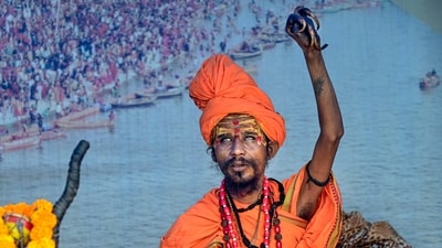  The spectacular parade, which is being held in Prayagraj under strict security, also includes a number of acrobatic performances by the Sadhus, including sword and stick battles. (PTI) The spectacular parade, which is being held in Prayagraj under strict security, also includes a number of acrobatic performances by the Sadhus, including sword and stick battles. (PTI)
