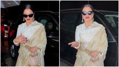 Rekha gets clicked by the paparazzi during a dinner outing. Rekha gets clicked by the paparazzi during a dinner outing.
