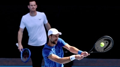 Serbia's Novak Djokovic (R) hits a return as coach Andy Murray looks on during a training session ahead of the Australian Open tennis tournament. (AFP) Serbia's Novak Djokovic (R) hits a return as coach Andy Murray looks on during a training session ahead of the Australian Open tennis tournament. (AFP)