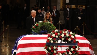 US President-elect Donald Trump and former US First Lady Melania Trump pay their respects in front of the flag-draped casket of former President Jimmy Carter at the US Capitol Rotunda in Washington, DC. Carter, the 39th President of the United States, died at the age of 100 on December 29, 2024 at his home in Plains, Georgia. (AFP) US President-elect Donald Trump and former US First Lady Melania Trump pay their respects in front of the flag-draped casket of former President Jimmy Carter at the US Capitol Rotunda in Washington, DC. Carter, the 39th President of the United States, died at the age of 100 on December 29, 2024 at his home in Plains, Georgia. (AFP)