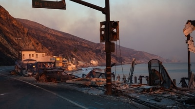 TOPSHOT - Buildings and cars destroyed by the Palisades fire lay along the Pacific Coast Highway in Malibu, California, on January 8, 2025. At least five people are now known to have died in wildfires raging around Los Angeles, with more deaths feared, law enforcement said January 8, as terrifying blazes leveled whole streets, torching cars and houses in minutes.
More than 1,000 buildings have burned in multiple wildfires that have erupted around America's second biggest city, forcing tens of thousands of people from their homes. (Photo by Zo� Meyers / AFP) (AFP) TOPSHOT - Buildings and cars destroyed by the Palisades fire lay along the Pacific Coast Highway in Malibu, California, on January 8, 2025. At least five people are now known to have died in wildfires raging around Los Angeles, with more deaths feared, law enforcement said January 8, as terrifying blazes leveled whole streets, torching cars and houses in minutes.
More than 1,000 buildings have burned in multiple wildfires that have erupted around America's second biggest city, forcing tens of thousands of people from their homes. (Photo by Zo� Meyers / AFP) (AFP)