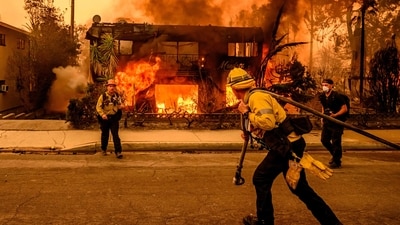 Firefighters work during the Eaton fire in the Altadena area of Los Angeles county (JOSH EDELSON / AFP) Firefighters work during the Eaton fire in the Altadena area of Los Angeles county (JOSH EDELSON / AFP)
