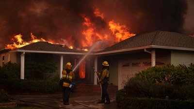 As firefighters continued to battle these blazes, the situation worsened overnight. The Eaton fire is currently at 0 per cent containment, with officials warning that extreme wind conditions would further intensify the fires. (Getty Images via AFP) As firefighters continued to battle these blazes, the situation worsened overnight. The Eaton fire is currently at 0 per cent containment, with officials warning that extreme wind conditions would further intensify the fires. (Getty Images via AFP)