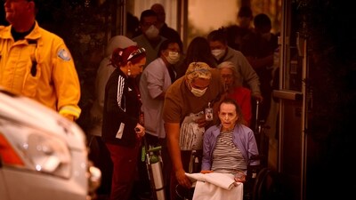 Patients are evacuated from the Brighton Care Center during the Eaton Fire in Pasadena, California, on January 08, 2025. (AFP) Patients are evacuated from the Brighton Care Center during the Eaton Fire in Pasadena, California, on January 08, 2025. (AFP)