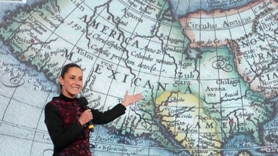 Mexico's President Claudia Sheinbaum shows a 1661 world map showing the Americas and the Gulf of Mexico in response to U.S. President-elect Donald Trump's comments about renaming the body of water, during a press conference at National Palace in Mexico City, Mexico, in this photo distributed on January 8, 2025. Presidencia de Mexico/Handout via REUTERS (via REUTERS)