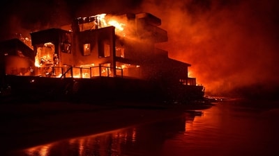 A beach house is engulfed in flames as the Palisades Fire burns along Pacific Coast Highway in Malibu, California, on January 8. (AFP) A beach house is engulfed in flames as the Palisades Fire burns along Pacific Coast Highway in Malibu, California, on January 8. (AFP)