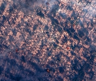This satellite image provided by Maxar Technologies shows burning and destroyed houses from the Eaton Fire near Marathon Road. (AP) This satellite image provided by Maxar Technologies shows burning and destroyed houses from the Eaton Fire near Marathon Road. (AP)