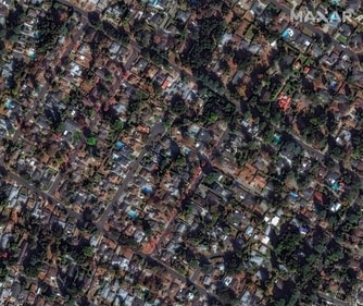 This satellite image provided by Maxar Technologies shows buildings near Marathon Road before the Eaton Fire, Jan. 8, 2025, in Altadena, California (AP) This satellite image provided by Maxar Technologies shows buildings near Marathon Road before the Eaton Fire, Jan. 8, 2025, in Altadena, California (AP)