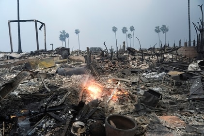 The Palisades Fire ravages a neighborhood amid high winds in the Pacific Palisades neighborhood of Los Angeles, Wednesday, Jan. 8, 2025. (AP) The Palisades Fire ravages a neighborhood amid high winds in the Pacific Palisades neighborhood of Los Angeles, Wednesday, Jan. 8, 2025. (AP)