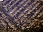 Homes are seen burned while a few still stand, Thursday, Jan. 9, 2025, in the Pacific Palisades section of Los Angeles. (AP Photo/Mark J. Terrill) Homes are seen burned while a few still stand, Thursday, Jan. 9, 2025, in the Pacific Palisades section of Los Angeles. (AP Photo/Mark J. Terrill)