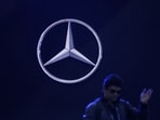 A man walks past the logo of Mercedes-Benz at Bharat Mobility Global Expo organised by India's commerce ministry at Pragati Maidan in New Delhi, India, February 1, 2024.